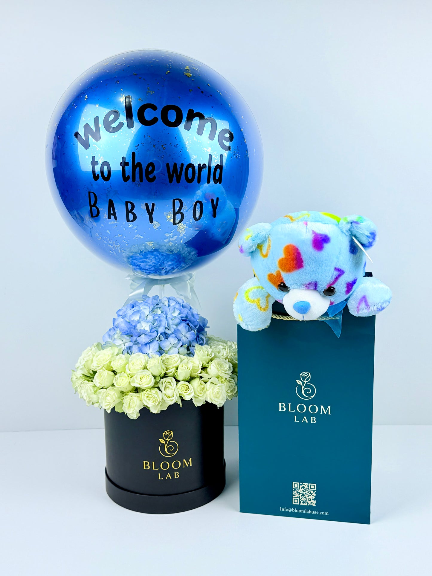 Blue personalized balloon with white and blue flowers – baby boy gift delivery in Dubai UAE