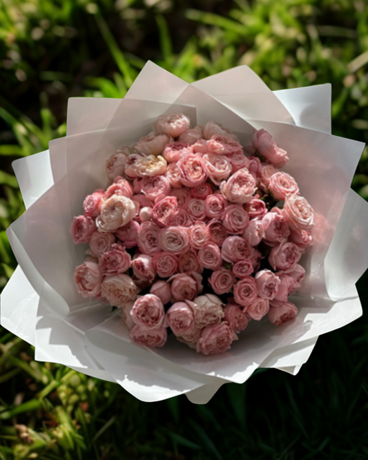 Hand-tied pink bombastic rose in premium Bloom Lab Bag 