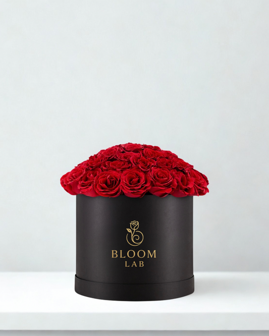 Black box with red roses and 'Bloom Lab' logo on a light gray background