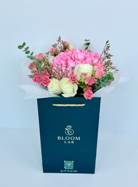 Pink hydrangea with white and blush roses in luxury Bag – flower delivery in Dubai