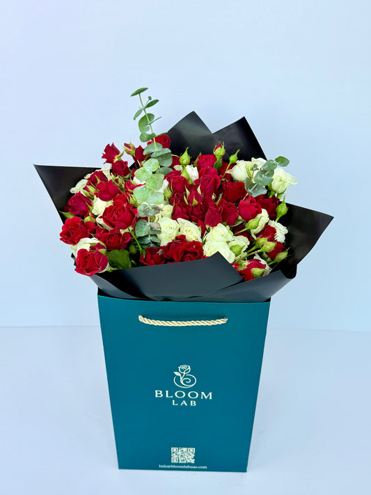 Red and white roses with eucalyptus leaves – luxury flower bouquet delivery in Dubai UAE

