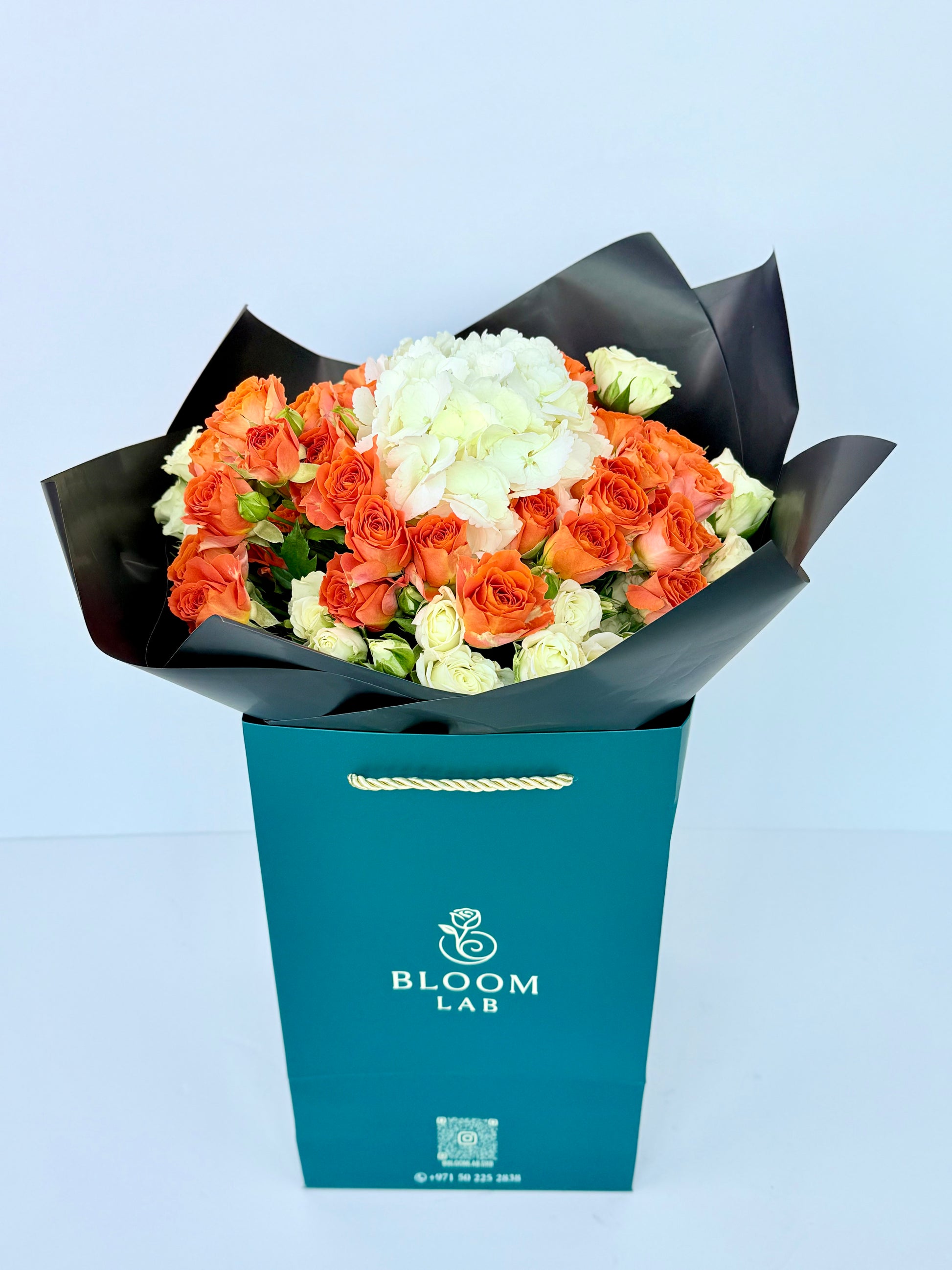 Orange roses with white hydrangeas and cream roses – luxury bouquet delivery in Dubai UAE