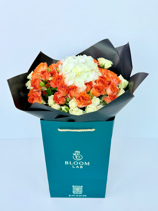 Orange roses with white hydrangeas and cream roses – luxury bouquet delivery in Dubai UAE
