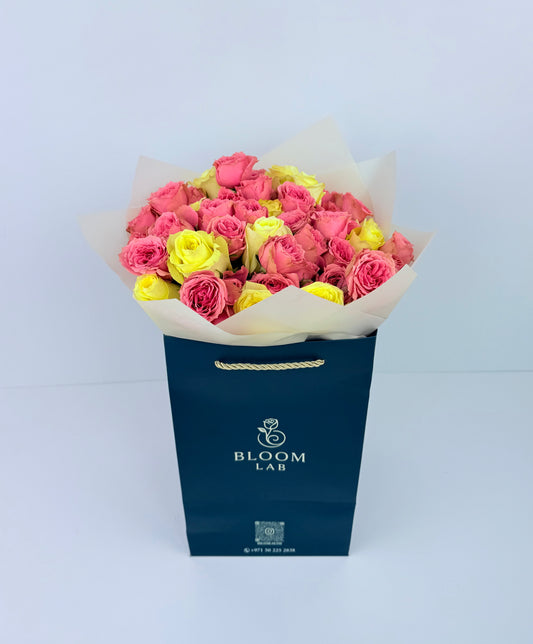 Pink and yellow rose bouquet – fresh online flowers in Dubai with free same-day delivery by Bloom Lab UAE.