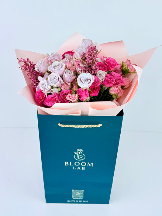 Lilac and pink roses bouquet with 35-40 fresh roses – online flowers in Dubai with free same-day delivery by Bloom Lab UAE.